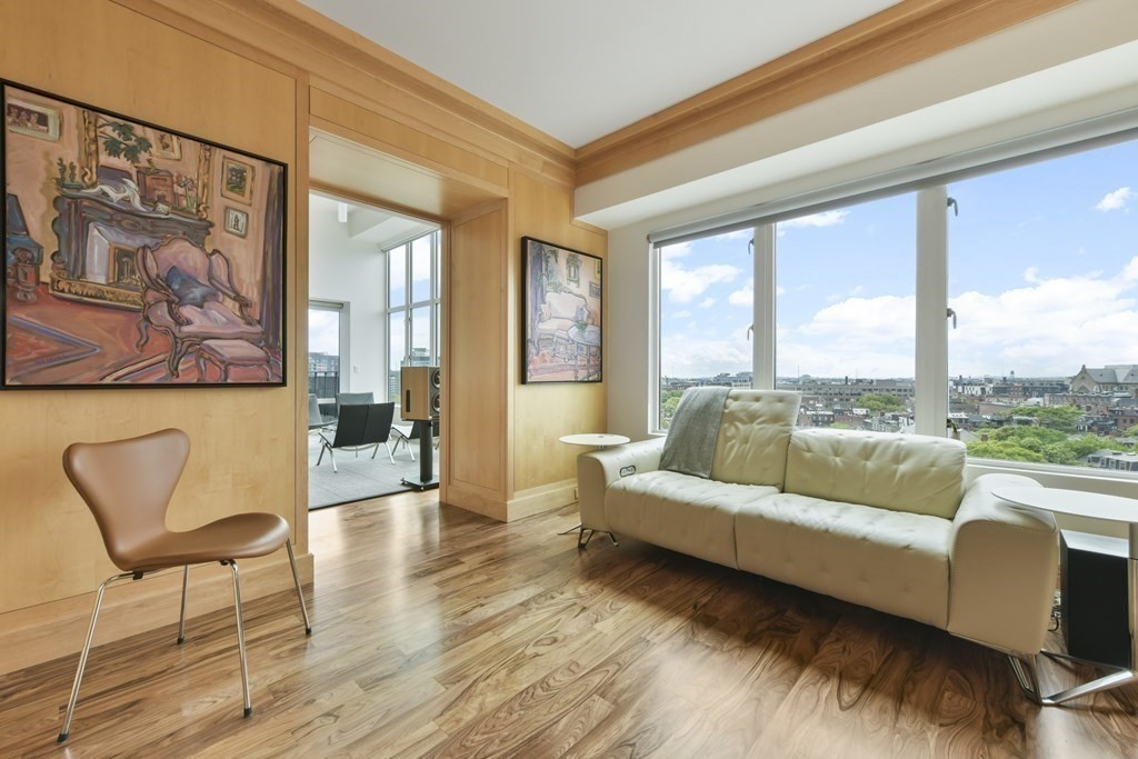 505 Tremont Street, Unit 904 Boston, MA 02116 - Photo 8 of 16 a living room with furniture and a large window