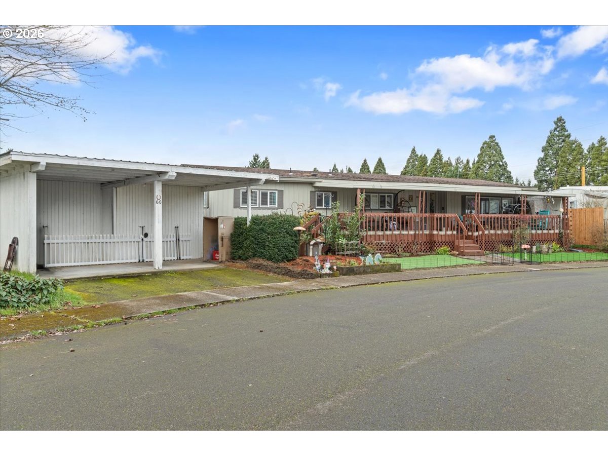 5355 River Road North, Unit 60 Keizer, OR 97303 - Photo 1 of 29 a front view of a house with a yard and potted plants