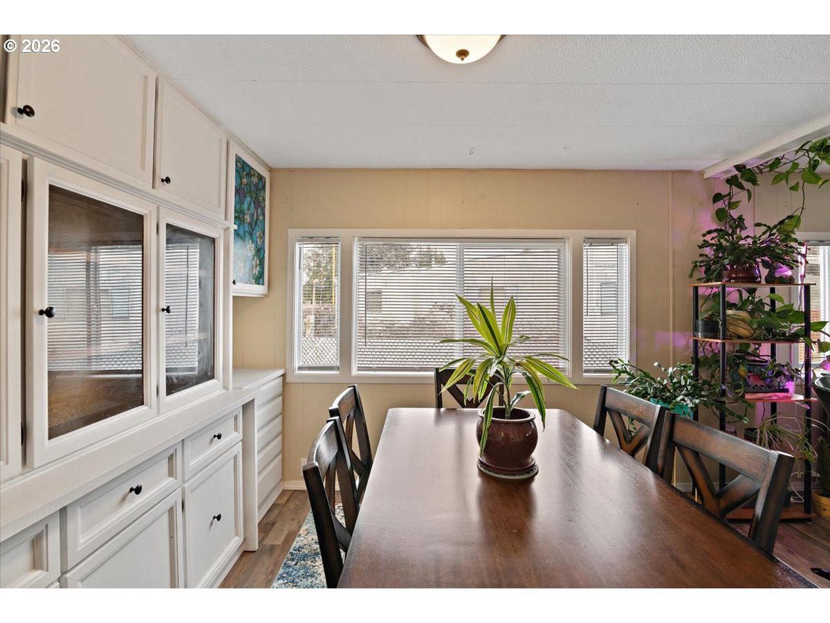 5355 River Road North, Unit 60 Keizer, OR 97303 - Photo 11 of 29 a living room with furniture a potted plant and a large window