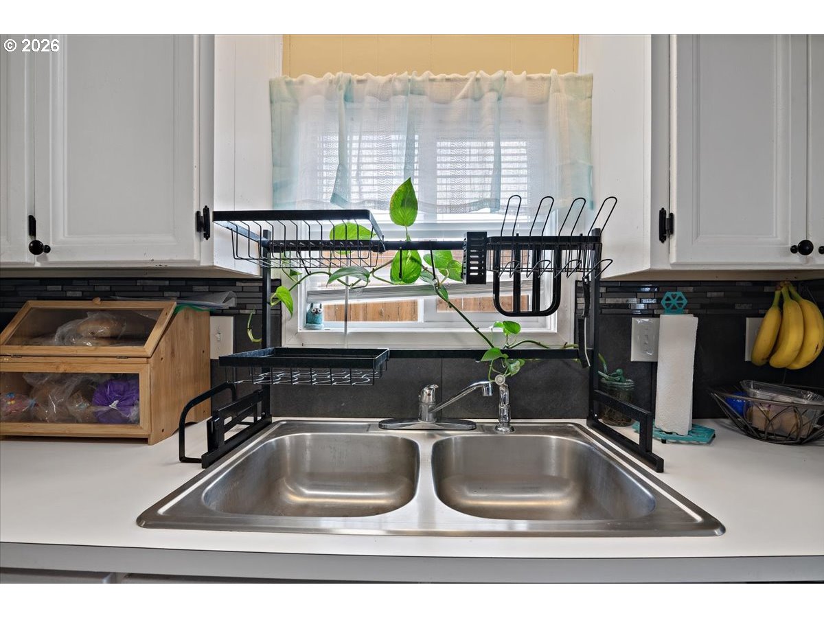 5355 River Road North, Unit 60 Keizer, OR 97303 - Photo 13 of 29 a kitchen with a sink and a cabinets