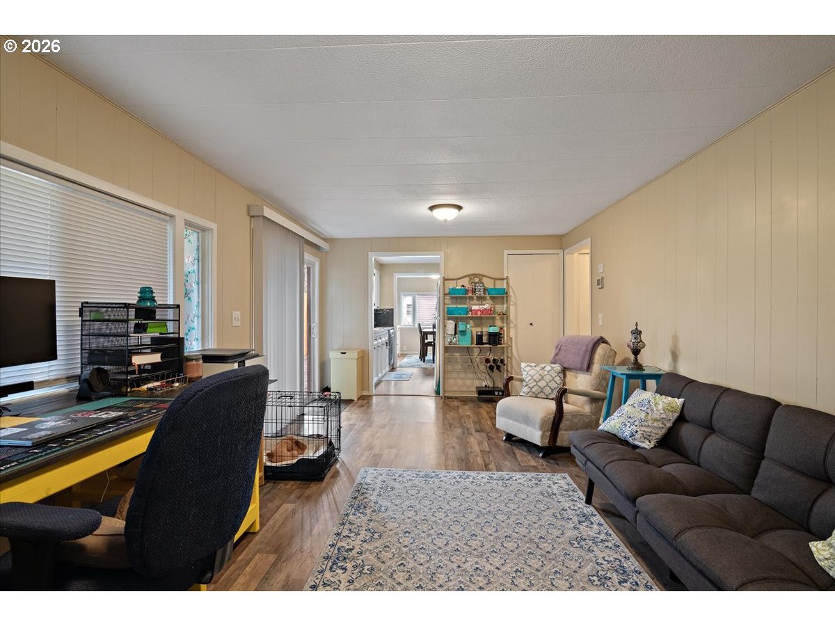 5355 River Road North, Unit 60 Keizer, OR 97303 - Photo 18 of 29 a living room with furniture and a flat screen tv