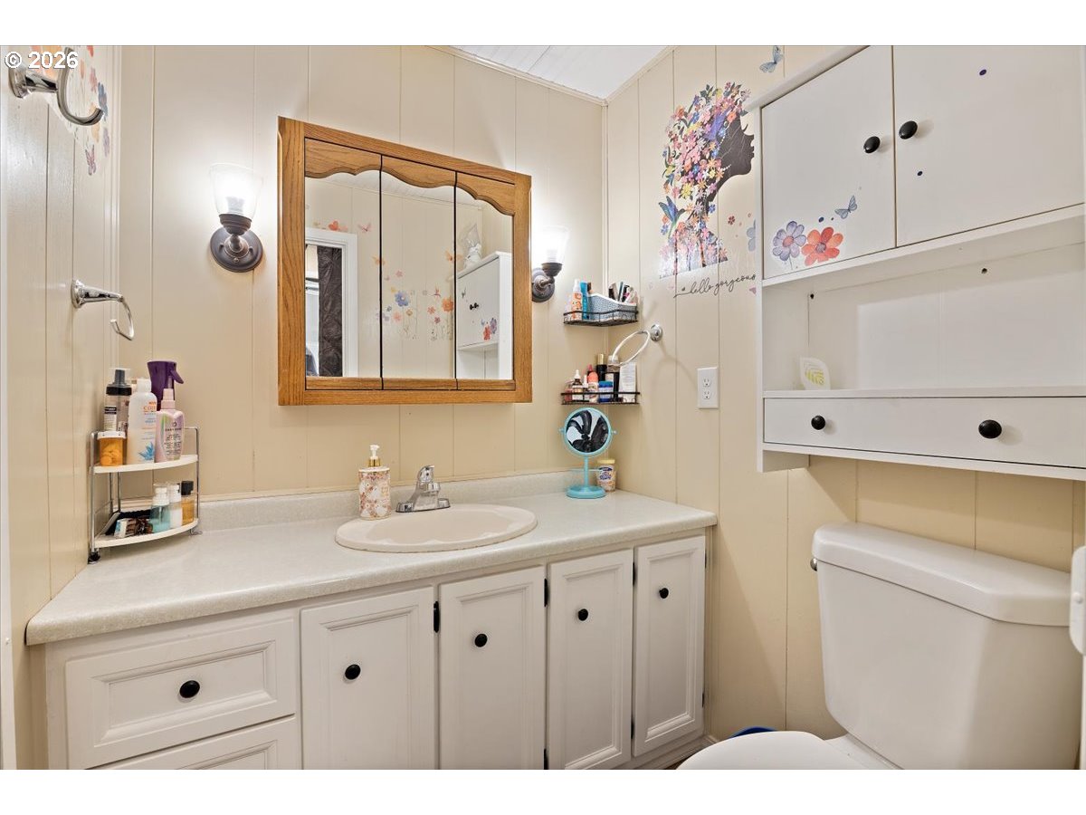 5355 River Road North, Unit 60 Keizer, OR 97303 - Photo 24 of 29 a bathroom with a sink vanity and a mirror