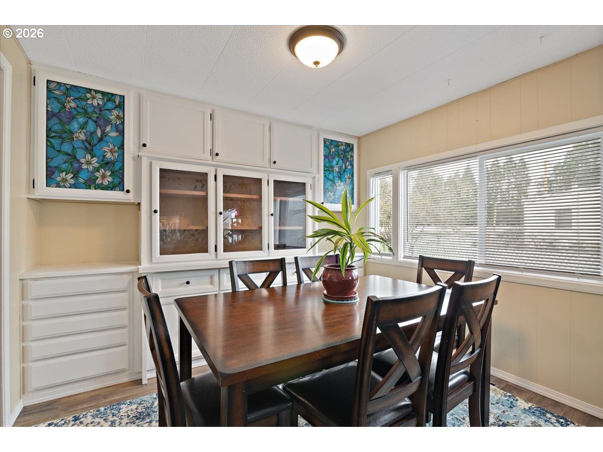 5355 River Road North, Unit 60 Keizer, OR 97303 - Photo 10 of 29 a view of a dining room with furniture and window