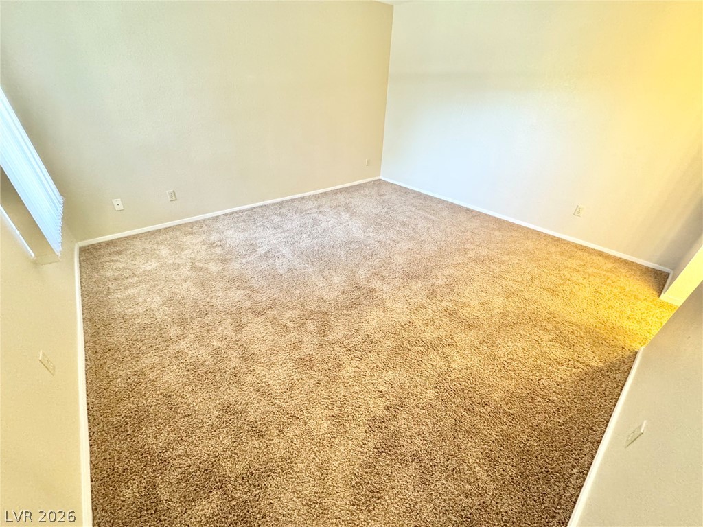 6250 West Flamingo Road, Unit 109 Las Vegas, NV 89103 - Photo 5 of 18 A spacious room offers plush carpeting and ample wall space.