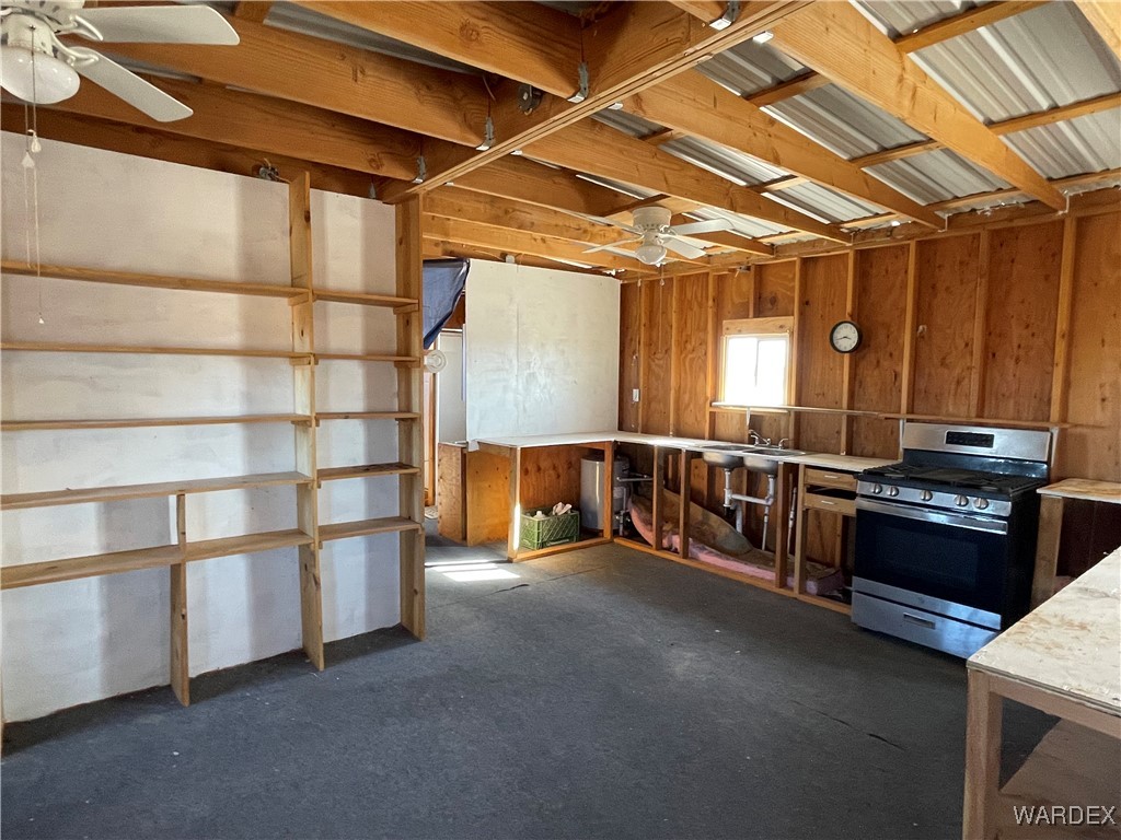 14360 Aripine Road Yucca, AZ 86438 - Photo 14 of 33 a view of a storage with a utility room