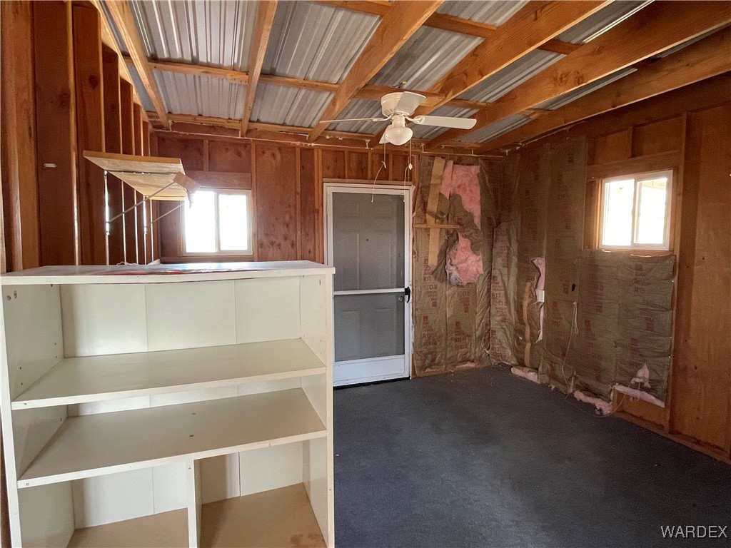 14360 Aripine Road Yucca, AZ 86438 - Photo 16 of 33 a view of an empty room with a kitchen