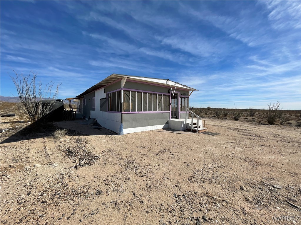 14360 Aripine Road Yucca, AZ 86438 - Photo 32 of 33 a view of a house with a snow