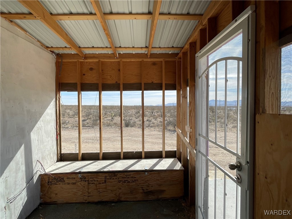 14360 Aripine Road Yucca, AZ 86438 - Photo 5 of 33 a bed sitting in a bedroom next to a window