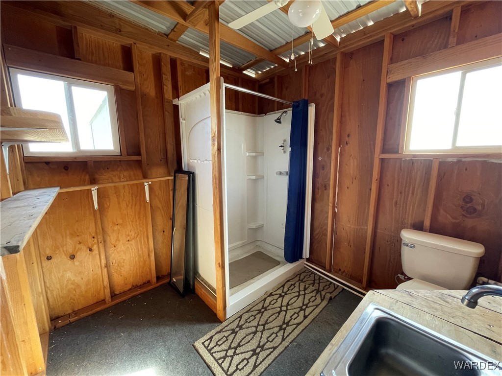 14360 Aripine Road Yucca, AZ 86438 - Photo 9 of 33 a bedroom with a bed and wooden floor