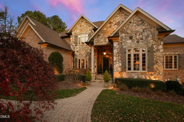 a living room with furniture fireplace and a chandelier
