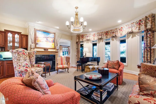 a living room with furniture fireplace and flat screen tv