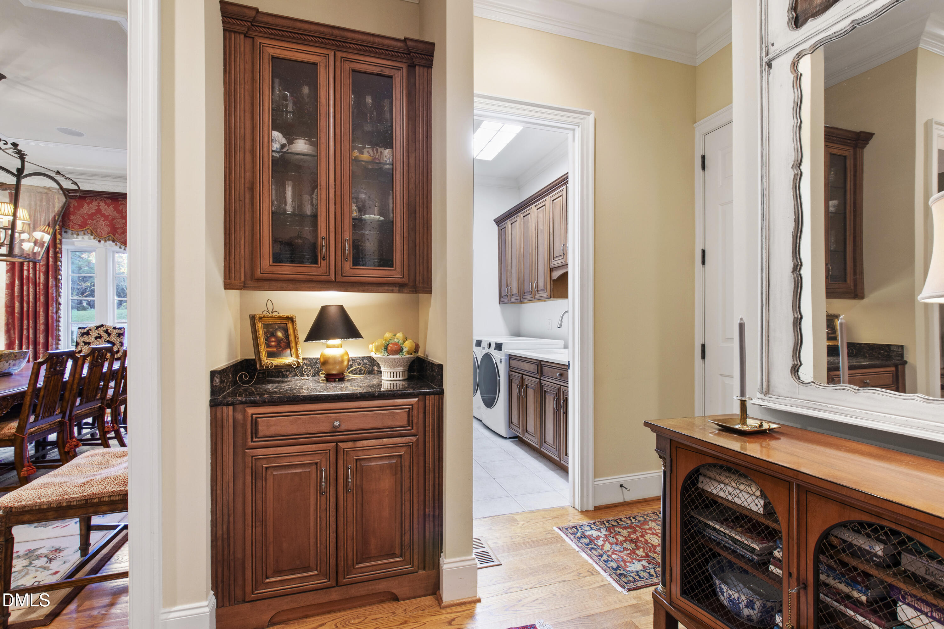 12345 Richmond Run Drive Raleigh, NC 27614 - Photo 25 of 90 a hallway with granite countertop a sink and a stove next to a large window
