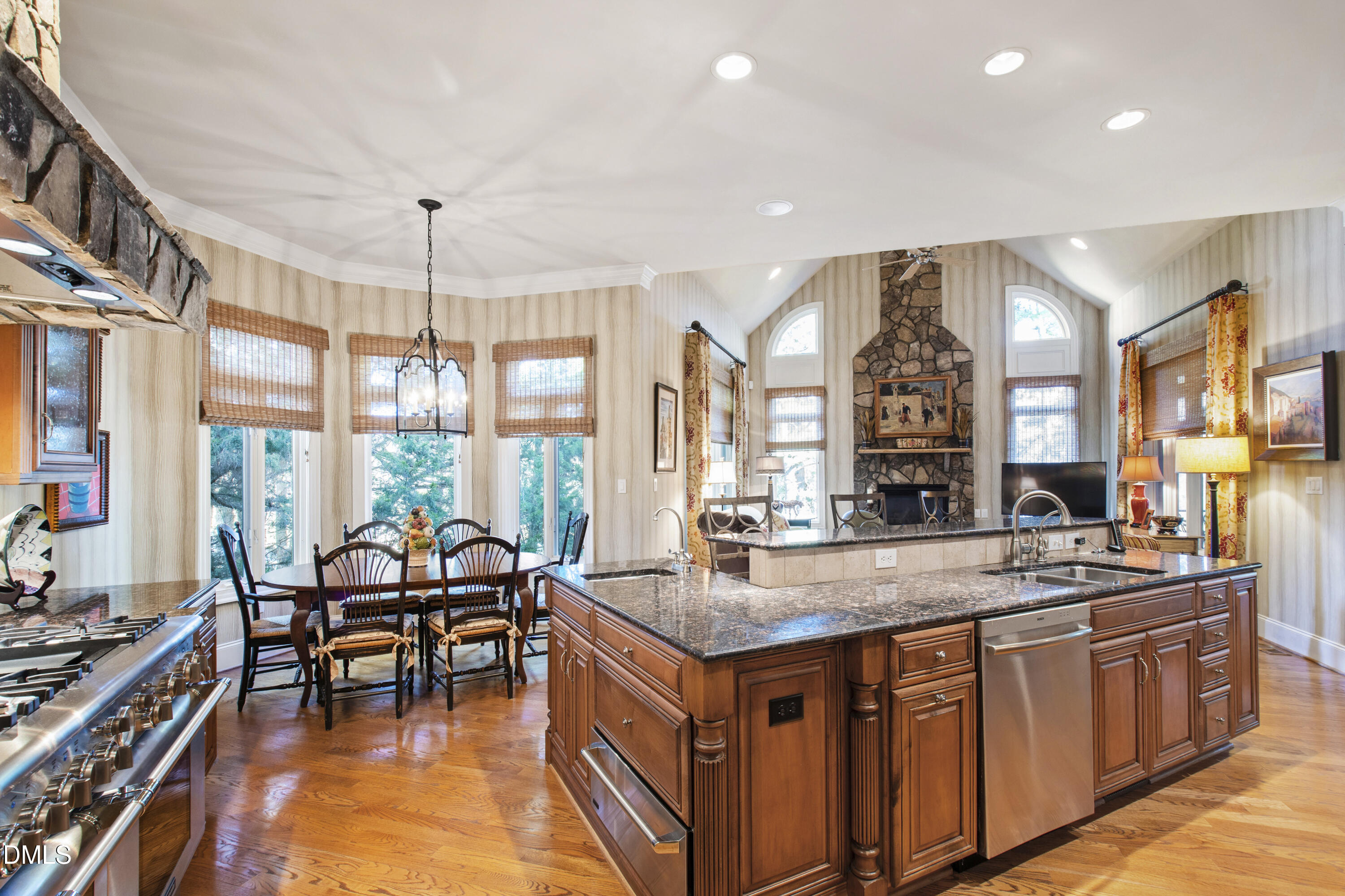 12345 Richmond Run Drive Raleigh, NC 27614 - Photo 27 of 90 a kitchen with stainless steel appliances granite countertop a stove and a sink