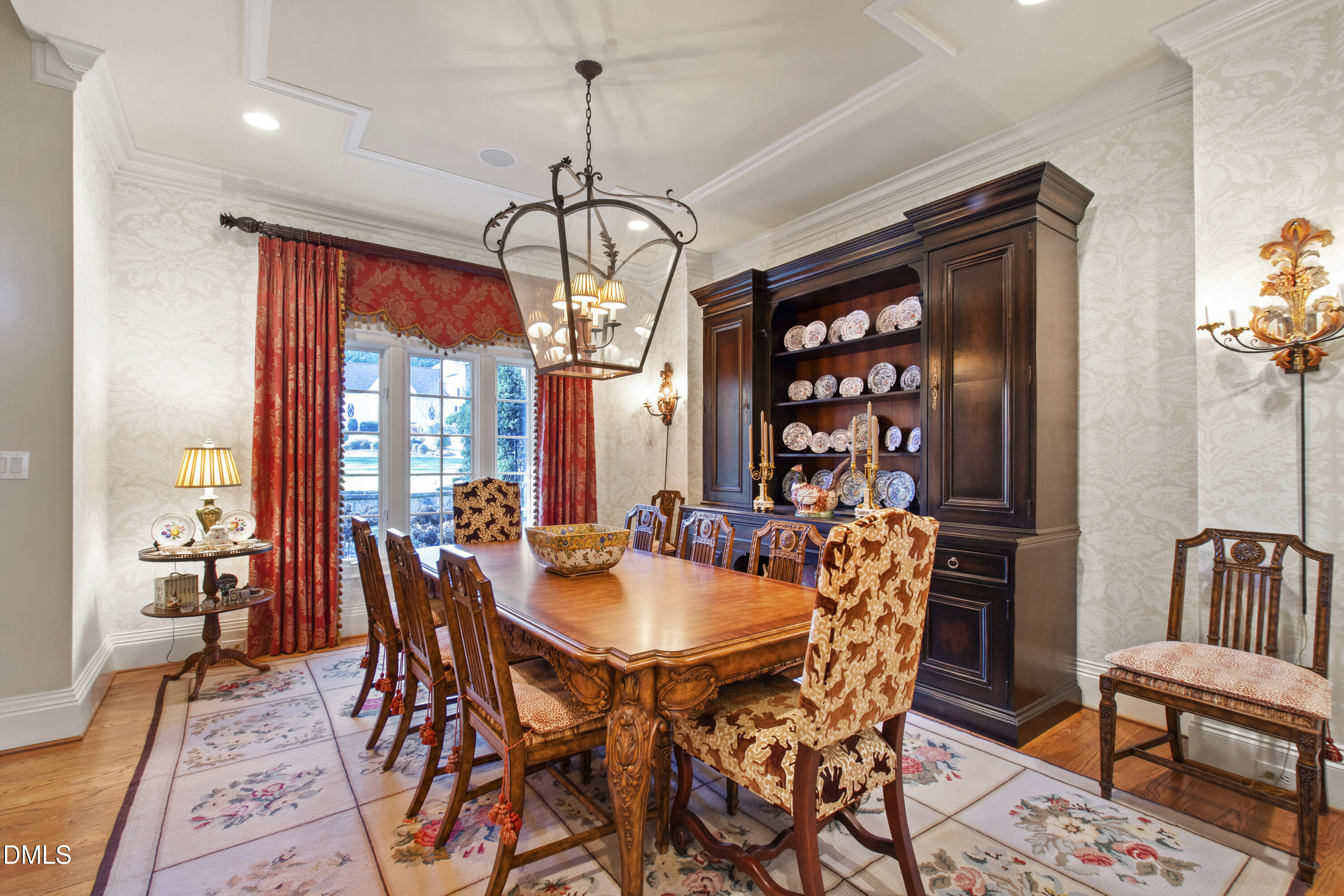 12345 Richmond Run Drive Raleigh, NC 27614 - Photo 27 of 98 a dining room with furniture a chandelier and wooden floor