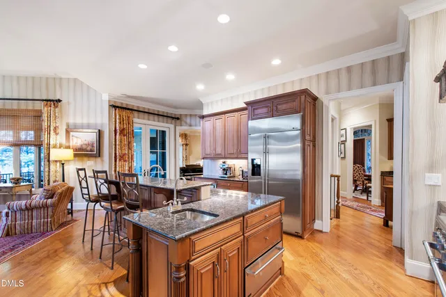 a living room with fireplace furniture and a flat screen tv
