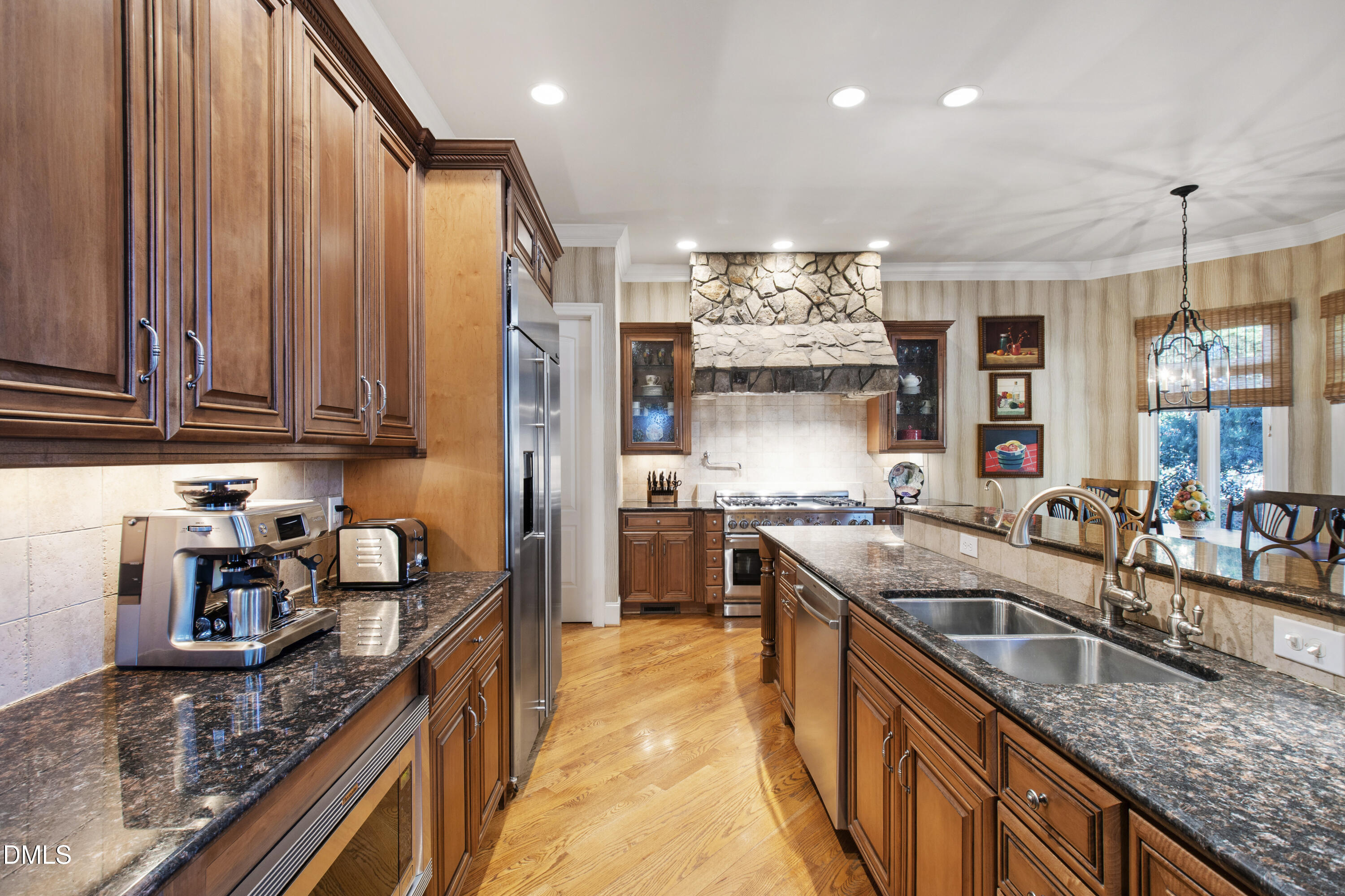 12345 Richmond Run Drive Raleigh, NC 27614 - Photo 30 of 90 a kitchen with stainless steel appliances granite countertop a sink stove and refrigerator