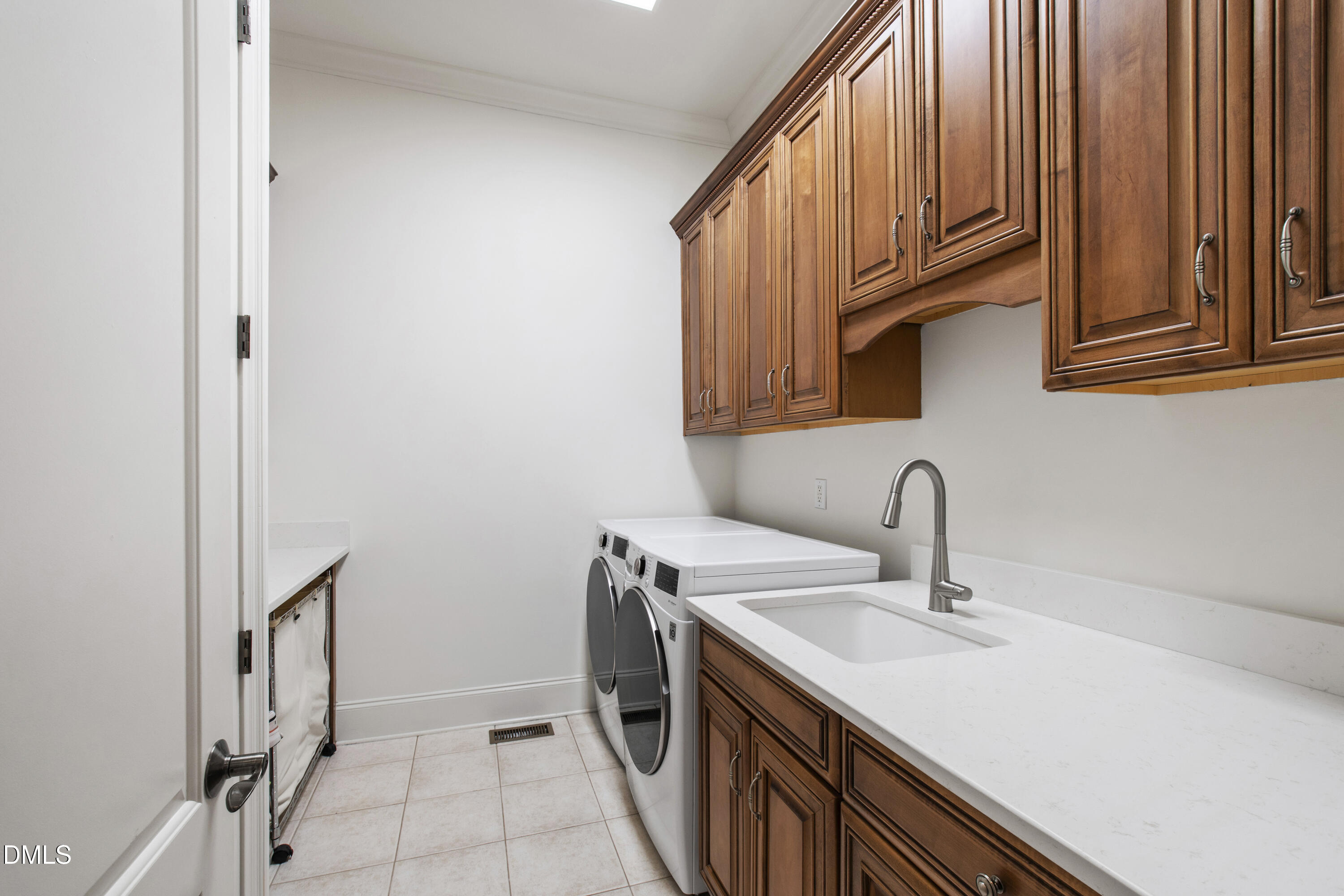 12345 Richmond Run Drive Raleigh, NC 27614 - Photo 34 of 98 a kitchen with a sink and cabinets