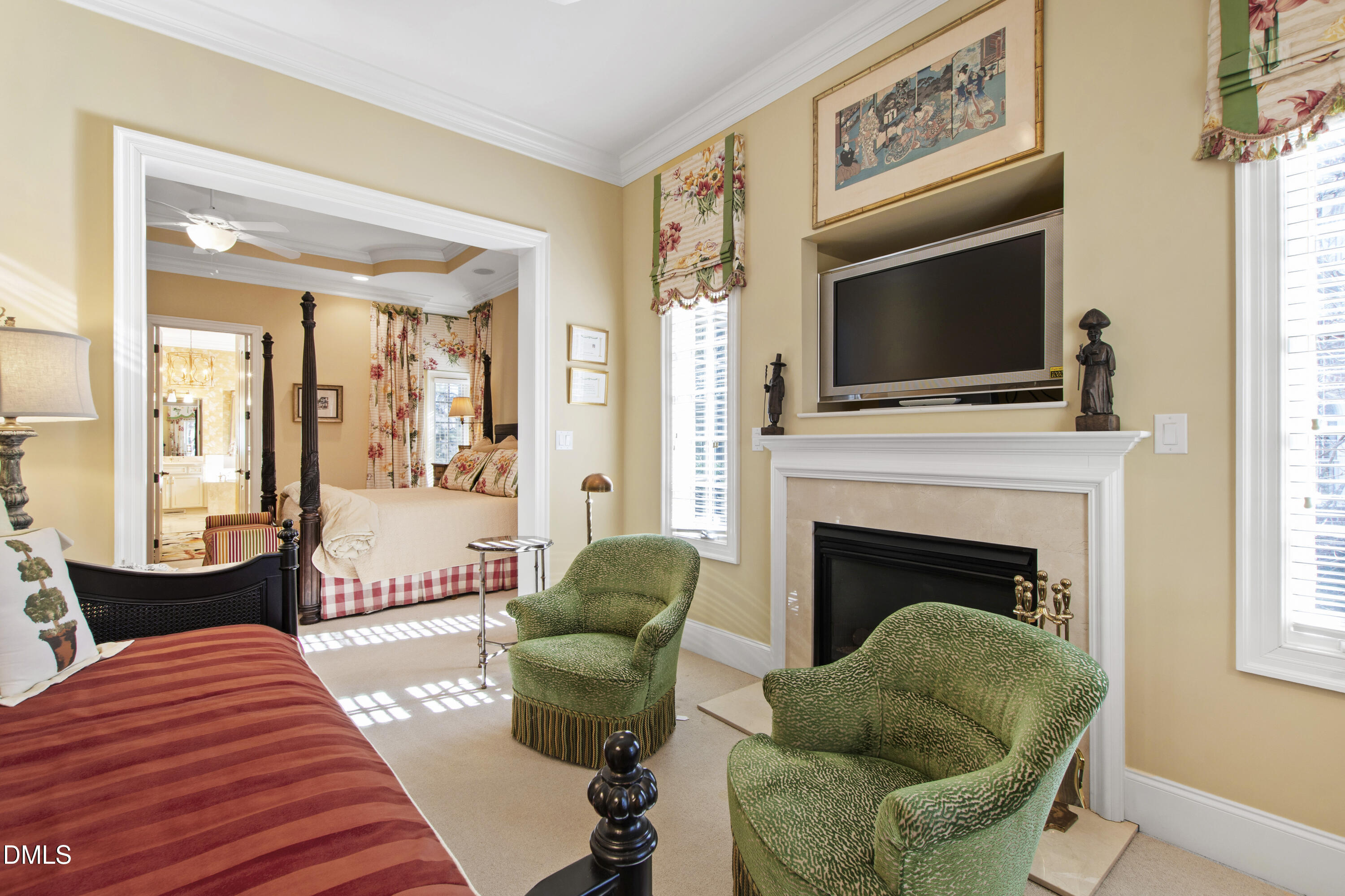 12345 Richmond Run Drive Raleigh, NC 27614 - Photo 41 of 90 a living room with furniture a flat screen tv and a fireplace