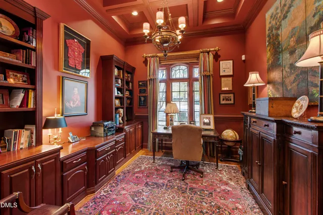 an aerial view of a house with a yard and garden