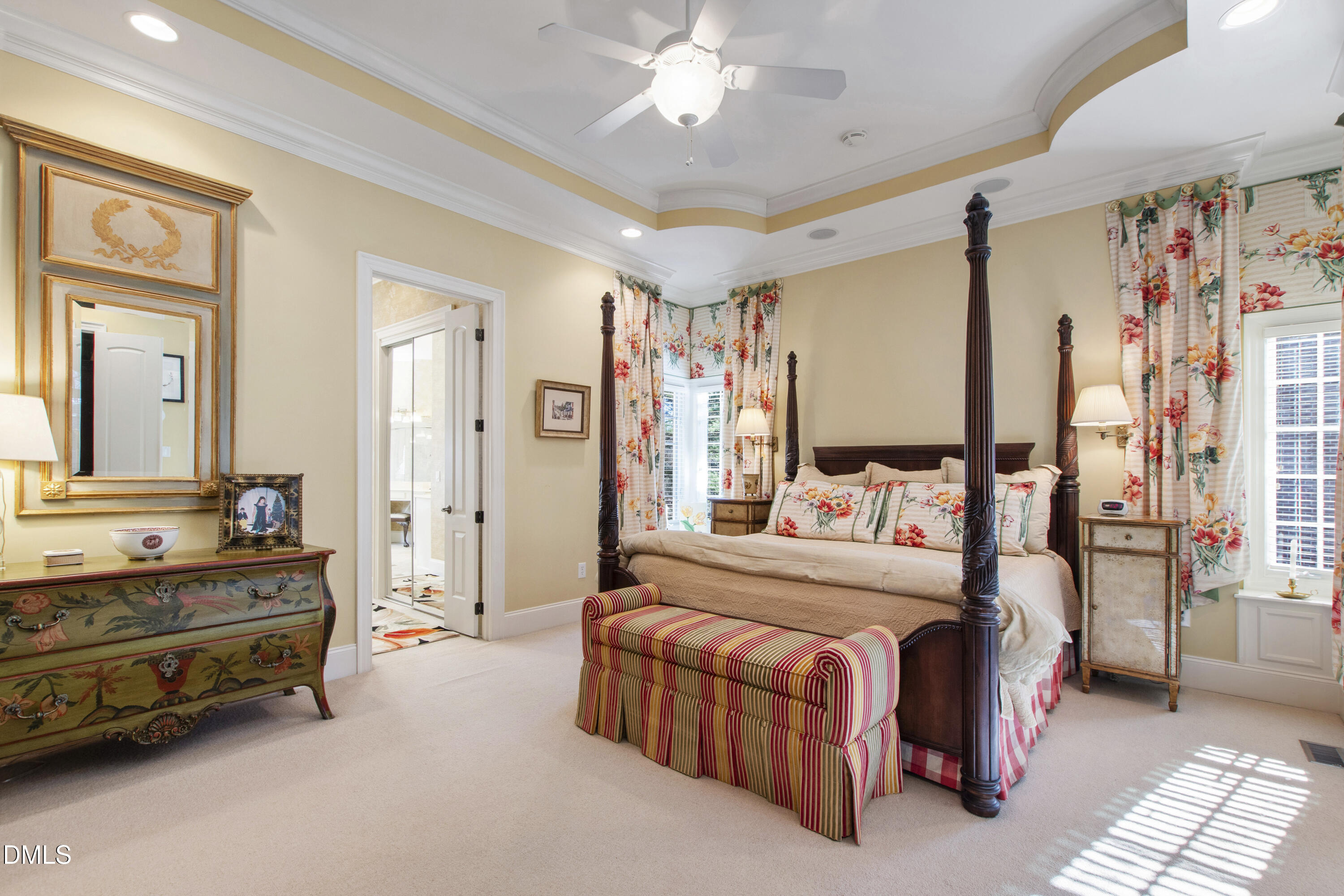 12345 Richmond Run Drive Raleigh, NC 27614 - Photo 47 of 98 a bedroom with a bed and a chandelier