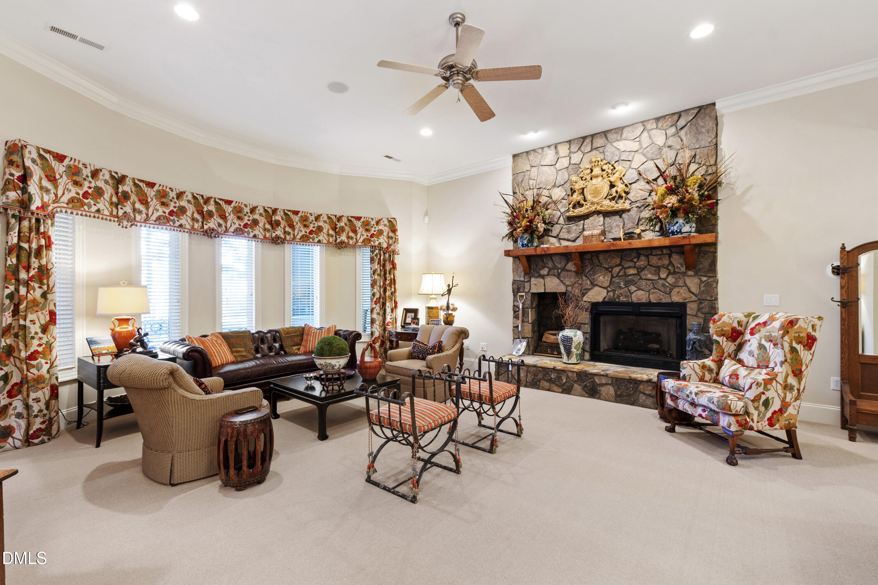 12345 Richmond Run Drive Raleigh, NC 27614 - Photo 52 of 90 a living room with furniture a fireplace and a flat screen tv
