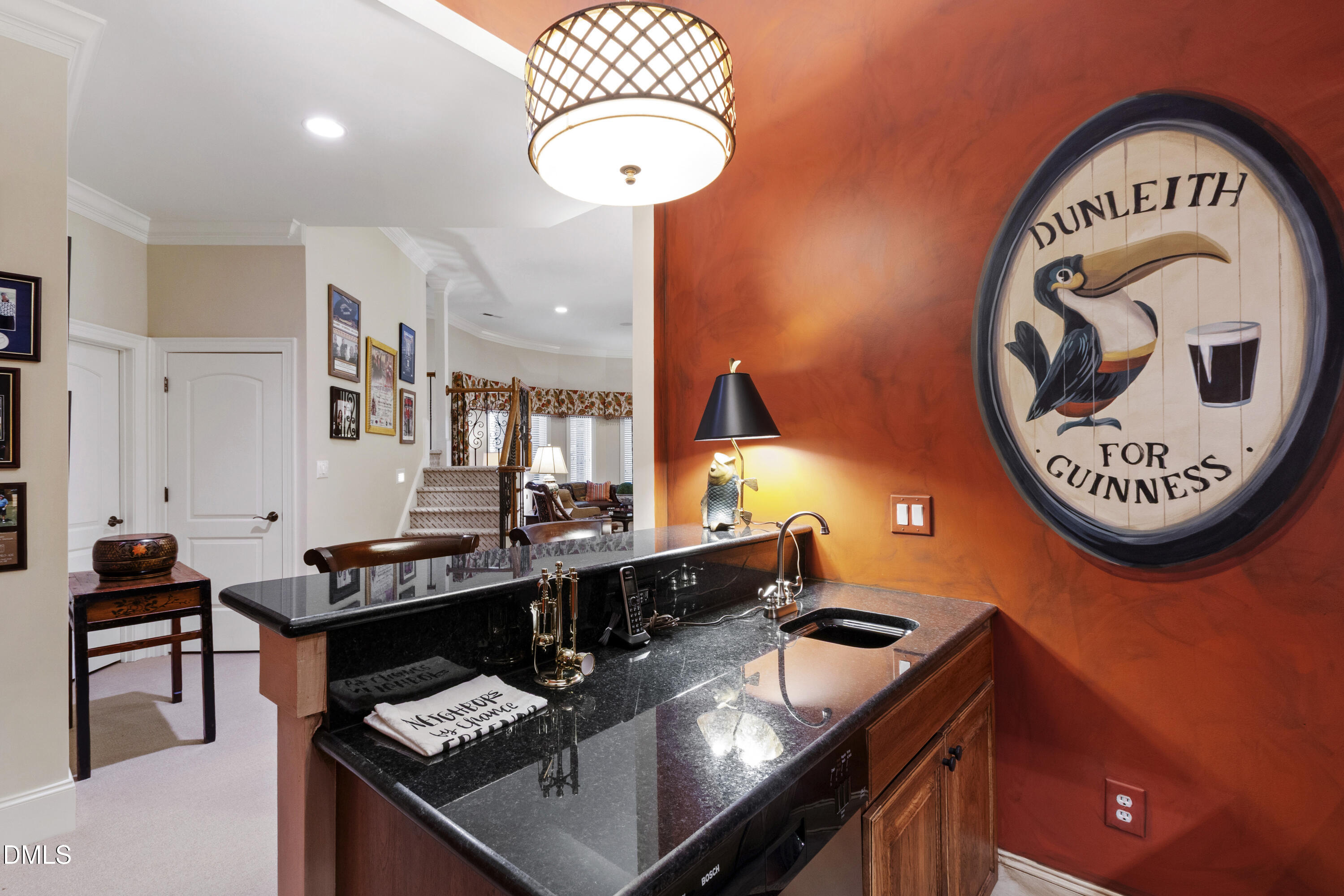 12345 Richmond Run Drive Raleigh, NC 27614 - Photo 62 of 98 a kitchen with stainless steel appliances granite countertop a stove a sink dishwasher and a dining table with wooden floor