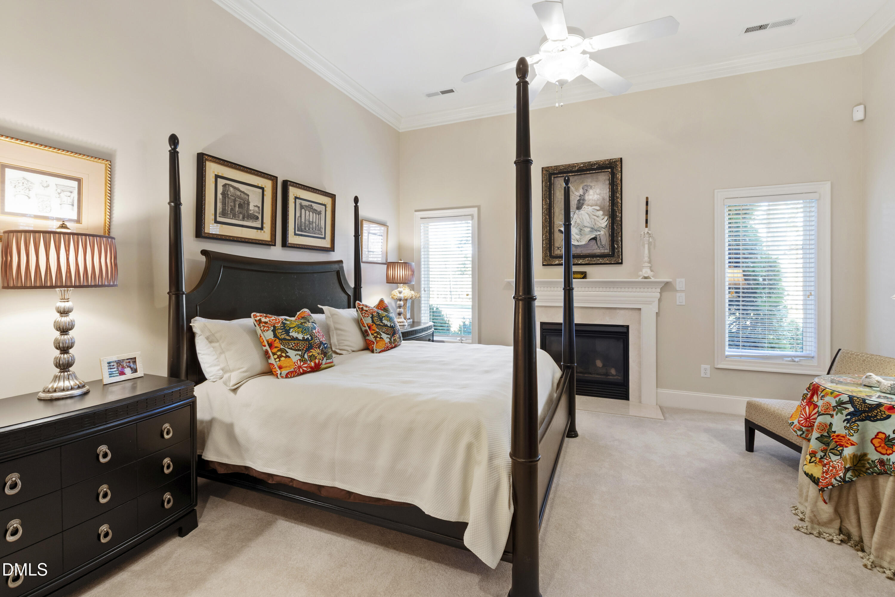 12345 Richmond Run Drive Raleigh, NC 27614 - Photo 74 of 98 a bedroom with a bed and a chandelier