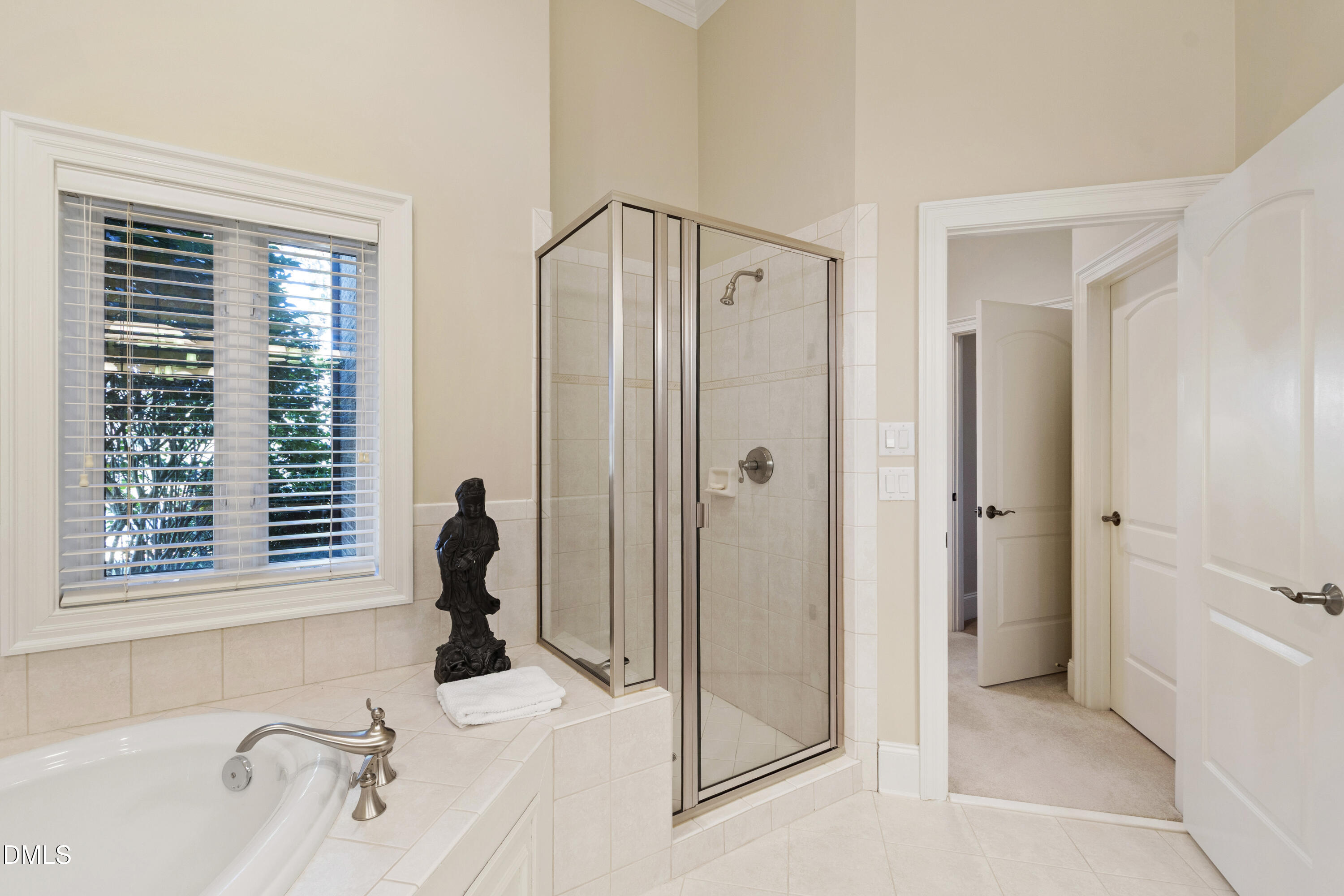 12345 Richmond Run Drive Raleigh, NC 27614 - Photo 77 of 98 a bathroom with a sink and a shower