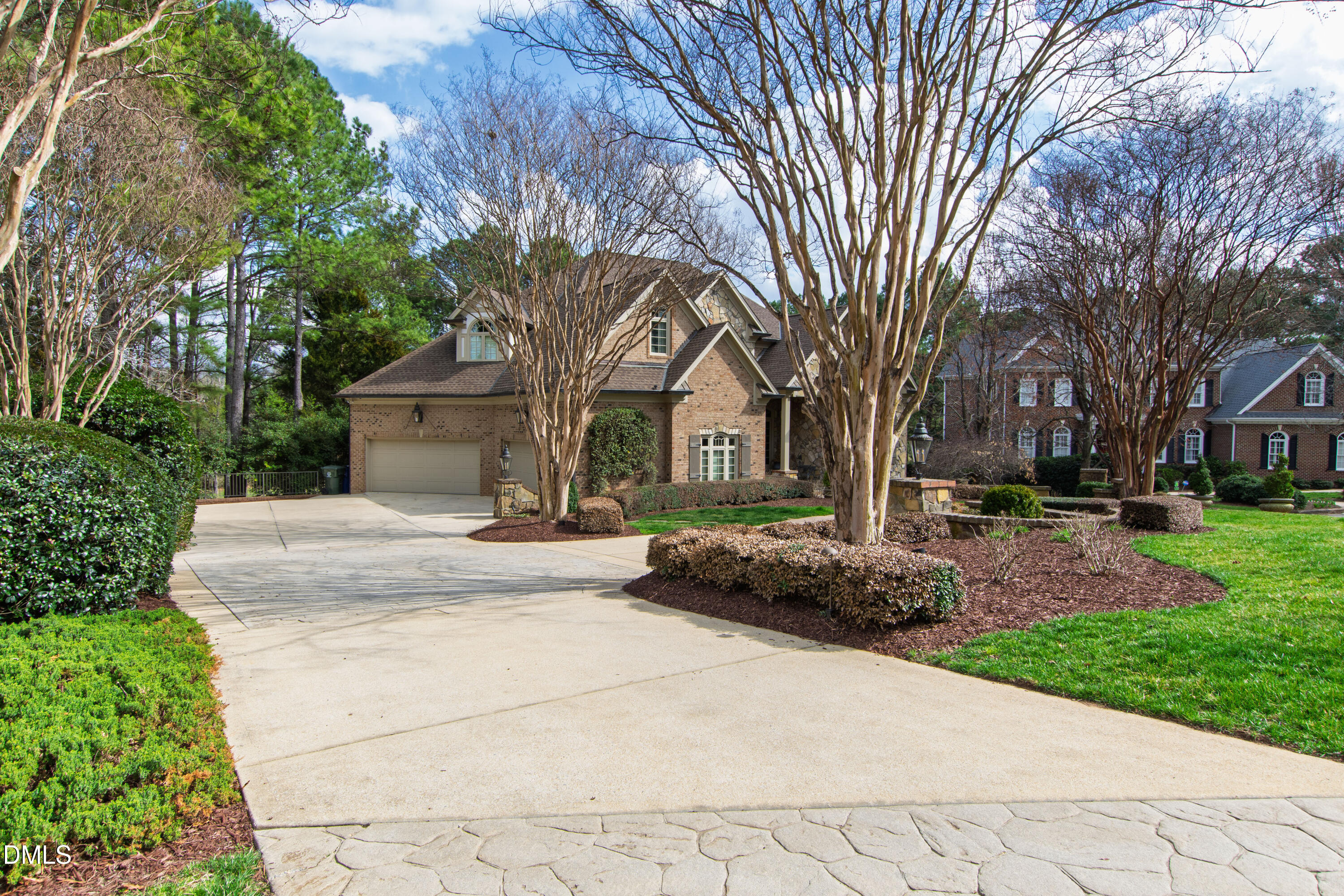 12345 Richmond Run Drive Raleigh, NC 27614 - Photo 10 of 98 a front view of a house with a garden and trees