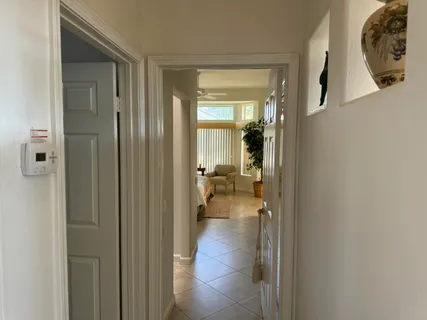 a view of a bathroom from a hallway