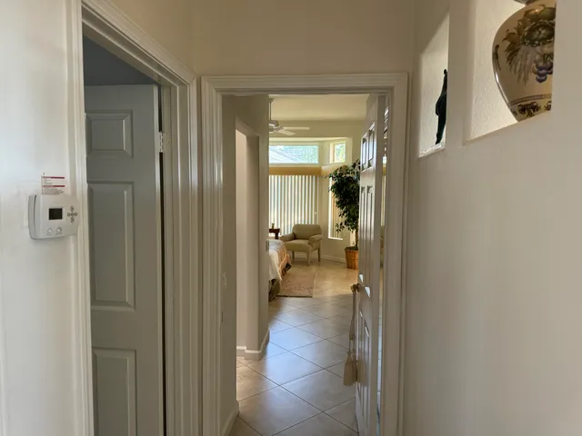 a view of a bathroom from a hallway