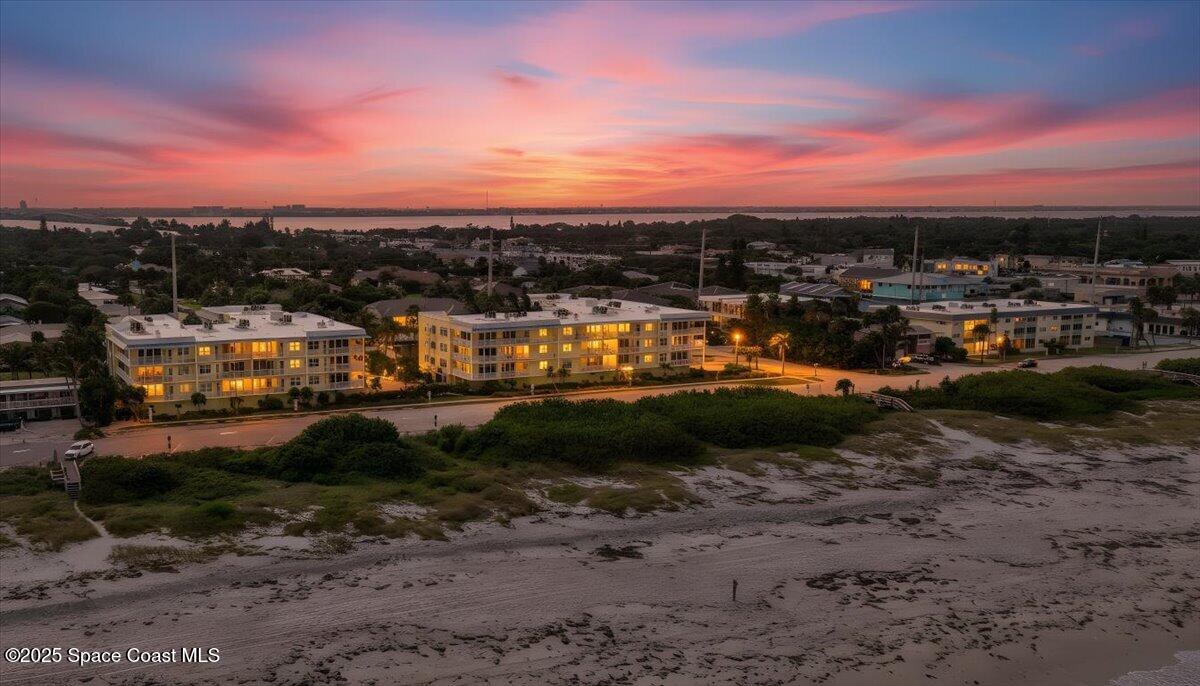 1 8th Avenue, Unit 1403 Indialantic, FL 32903 - Photo 18 of 69 a view of a lake with large trees