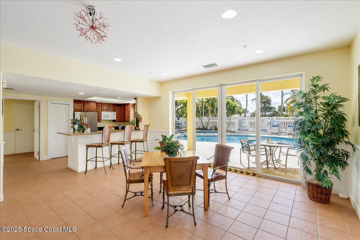 1 8th Avenue, Unit 1403 Indialantic, FL 32903 - Photo 2 of 69 a dining room with furniture and a floor to ceiling window