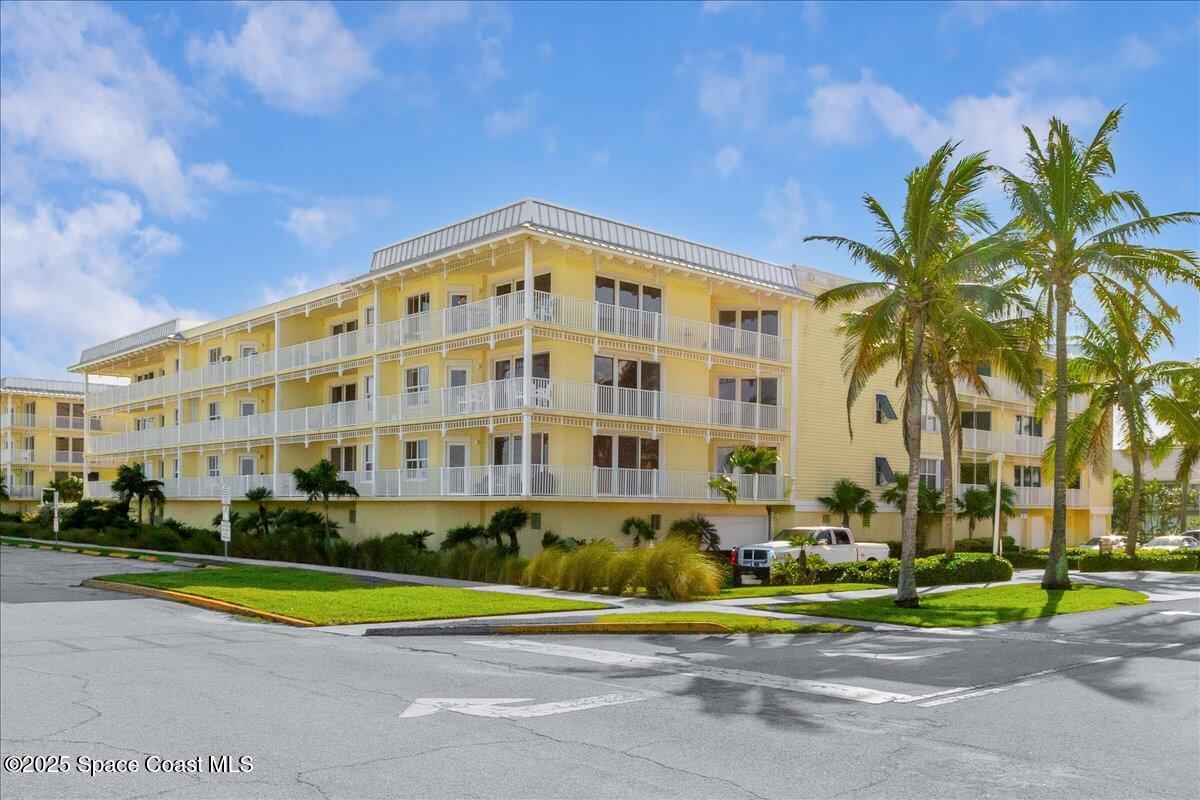 1 8th Avenue, Unit 1403 Indialantic, FL 32903 - Photo 29 of 69 a view of a tall building next to a road