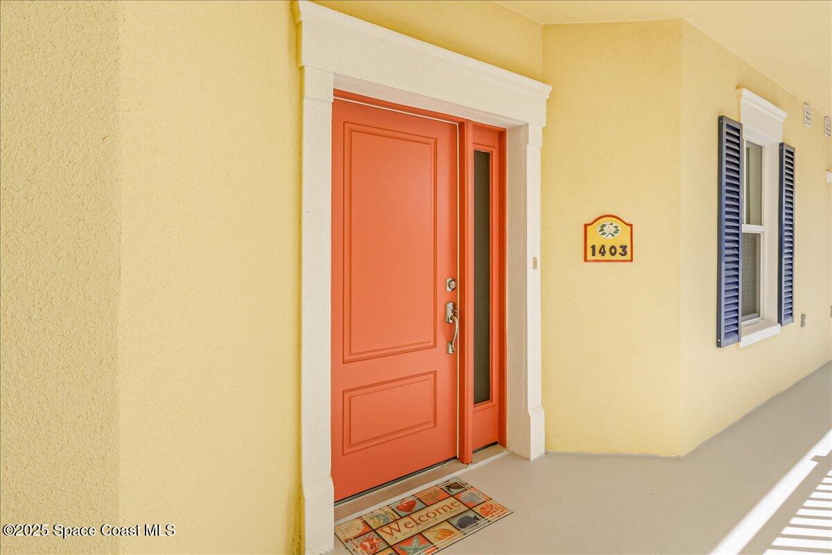 1 8th Avenue, Unit 1403 Indialantic, FL 32903 - Photo 32 of 69 a view of front door with wooden floor