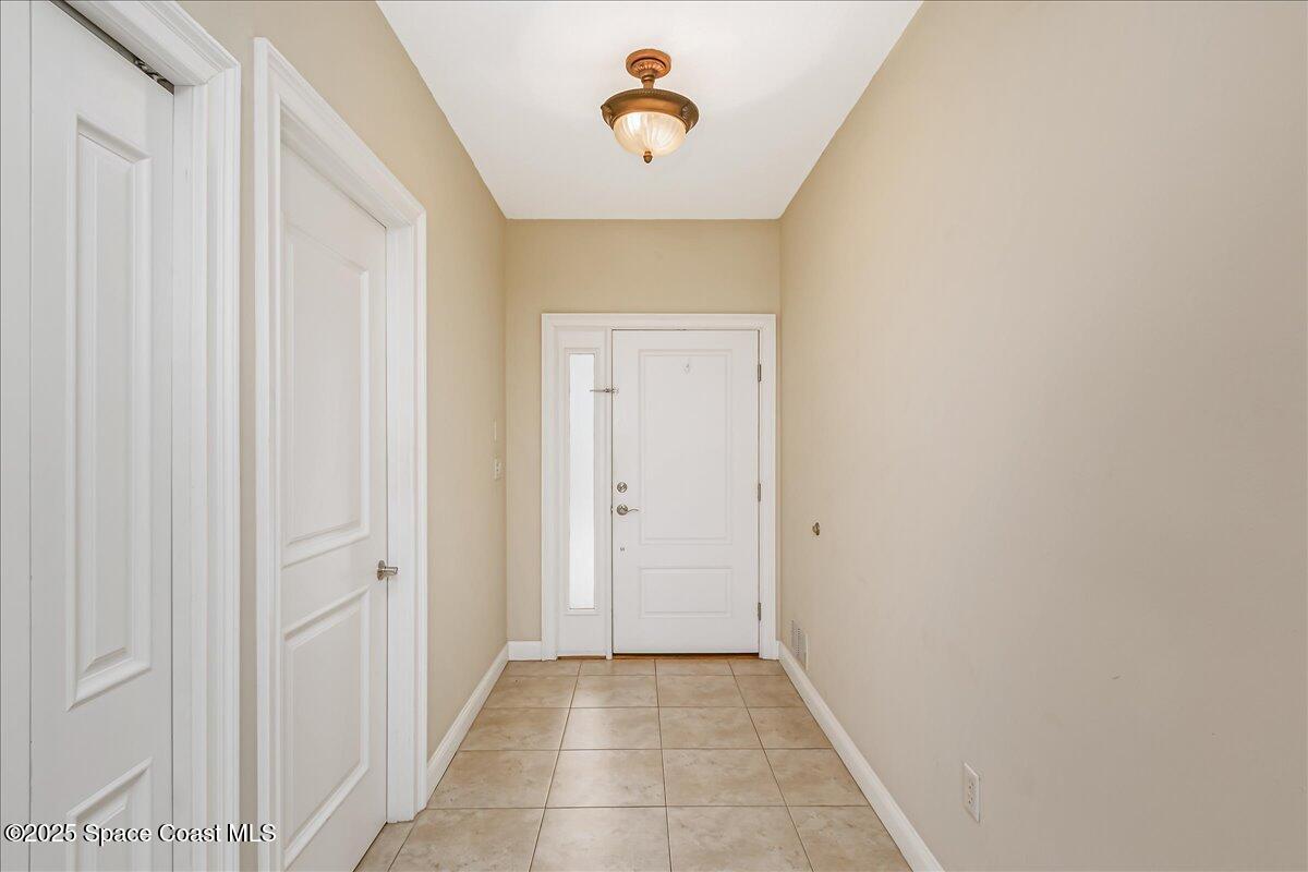 1 8th Avenue, Unit 1403 Indialantic, FL 32903 - Photo 33 of 69 a view of a hallway