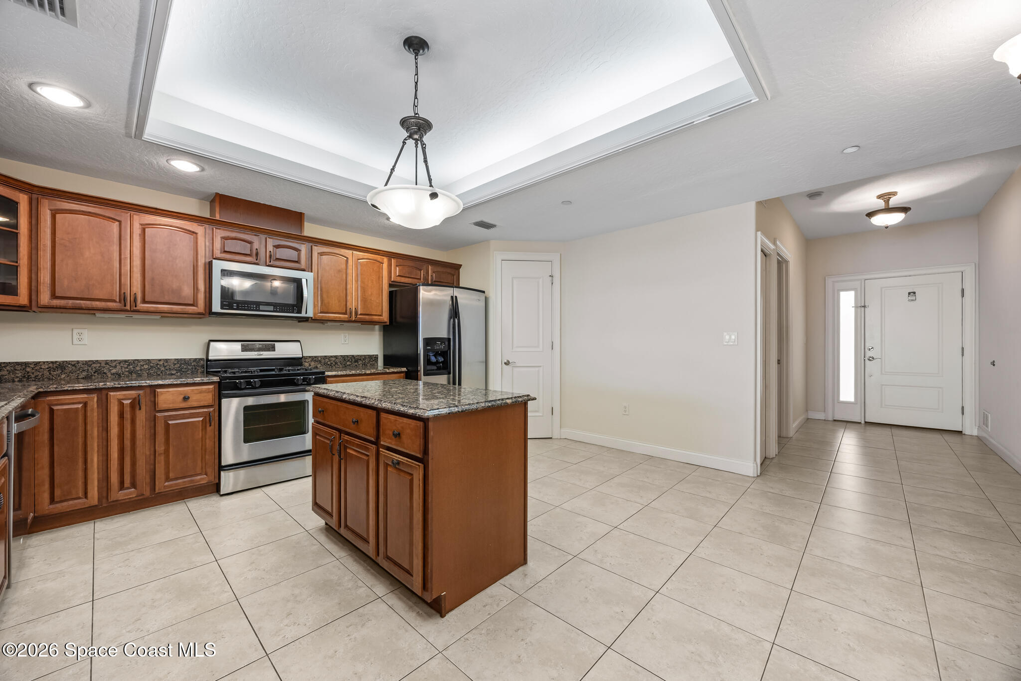1 8th Avenue, Unit 1403 Indialantic, FL 32903 - Photo 36 of 69 a kitchen with stainless steel appliances granite countertop a stove top oven a sink dishwasher a refrigerator and a oven