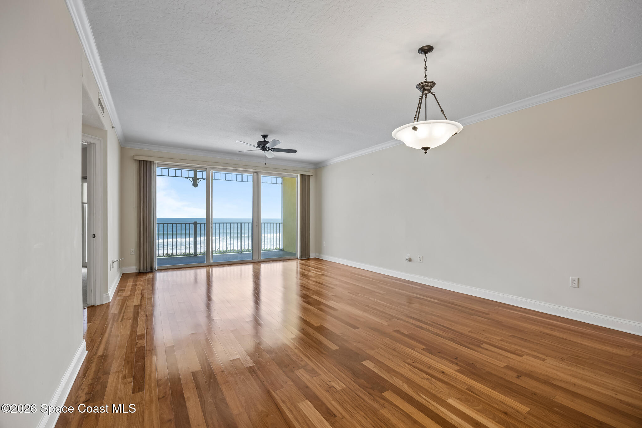 1 8th Avenue, Unit 1403 Indialantic, FL 32903 - Photo 39 of 69 a view of an empty room with wooden floor and a window