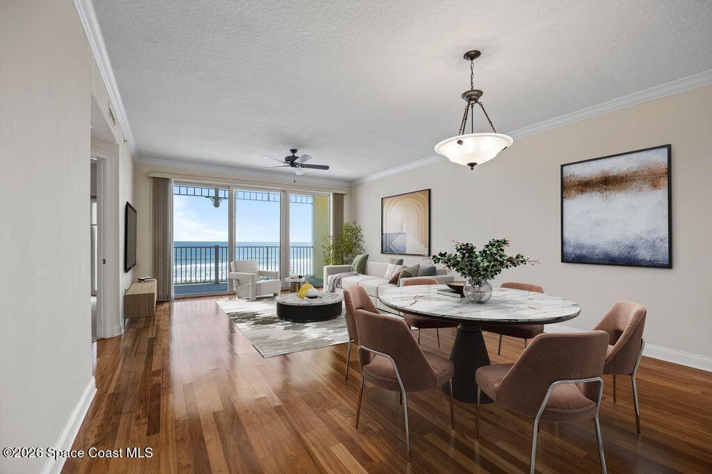1 8th Avenue, Unit 1403 Indialantic, FL 32903 - Photo 40 of 69 a view of a dining room with furniture wooden floor and chandelier