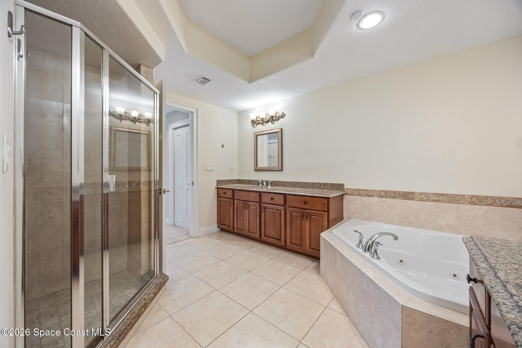 1 8th Avenue, Unit 1403 Indialantic, FL 32903 - Photo 49 of 69 a bathroom with a tub sink and mirror
