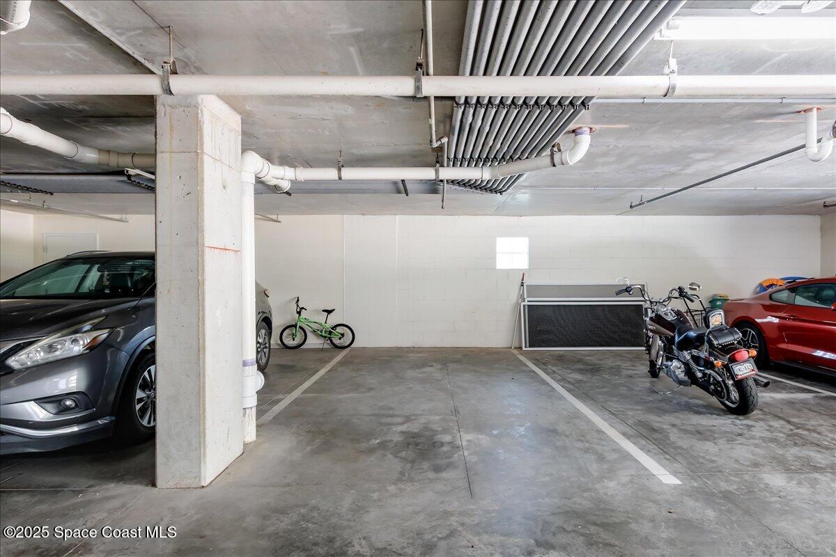 1 8th Avenue, Unit 1403 Indialantic, FL 32903 - Photo 61 of 69 a view of a garage with rack and bicycle