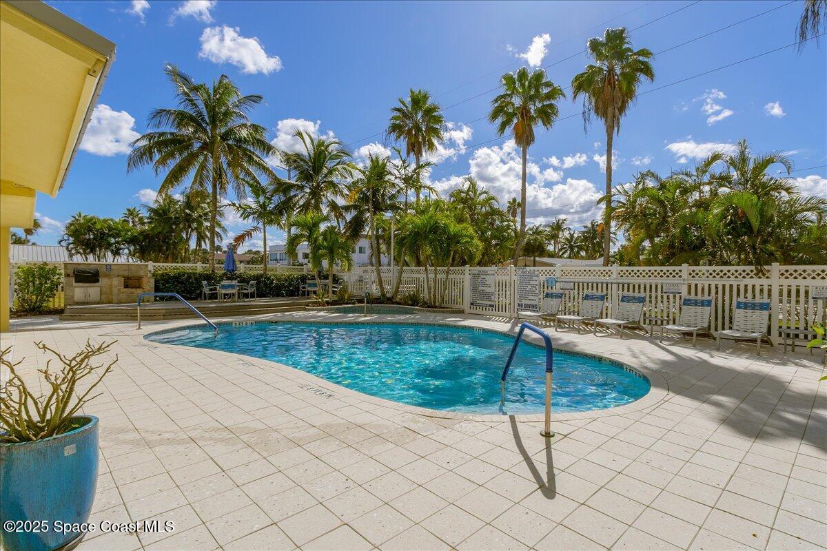 1 8th Avenue, Unit 1403 Indialantic, FL 32903 - Photo 63 of 69 a swimming pool with chairs
