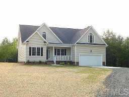 3635 Range Road Stem, NC 27581 - Photo 1 of 1 a front view of a house with a garden