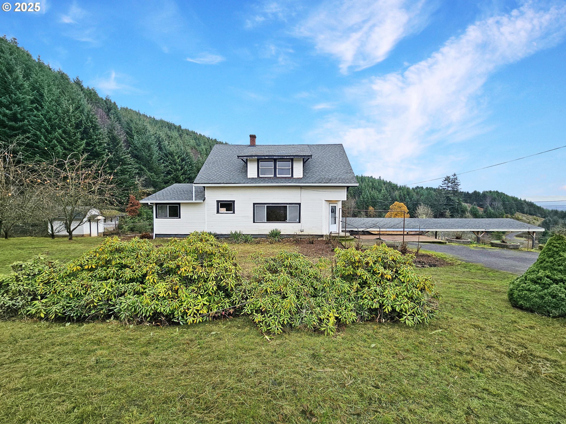 32373 Southwest JP W Road Scappoose, OR 97056 - Photo 1 of 44 a front view of a house with a garden