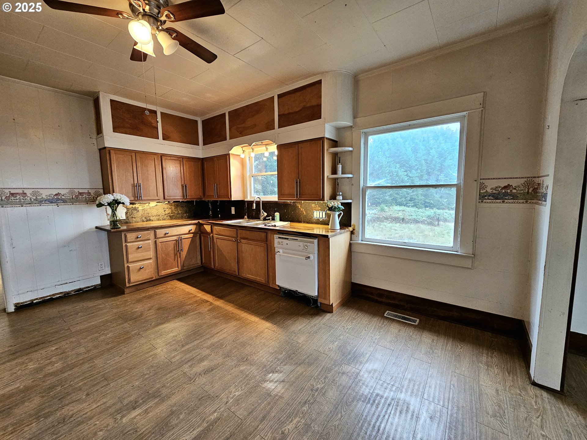 32373 Southwest JP W Road Scappoose, OR 97056 - Photo 12 of 44 a kitchen with stainless steel appliances a stove a sink and a refrigerator