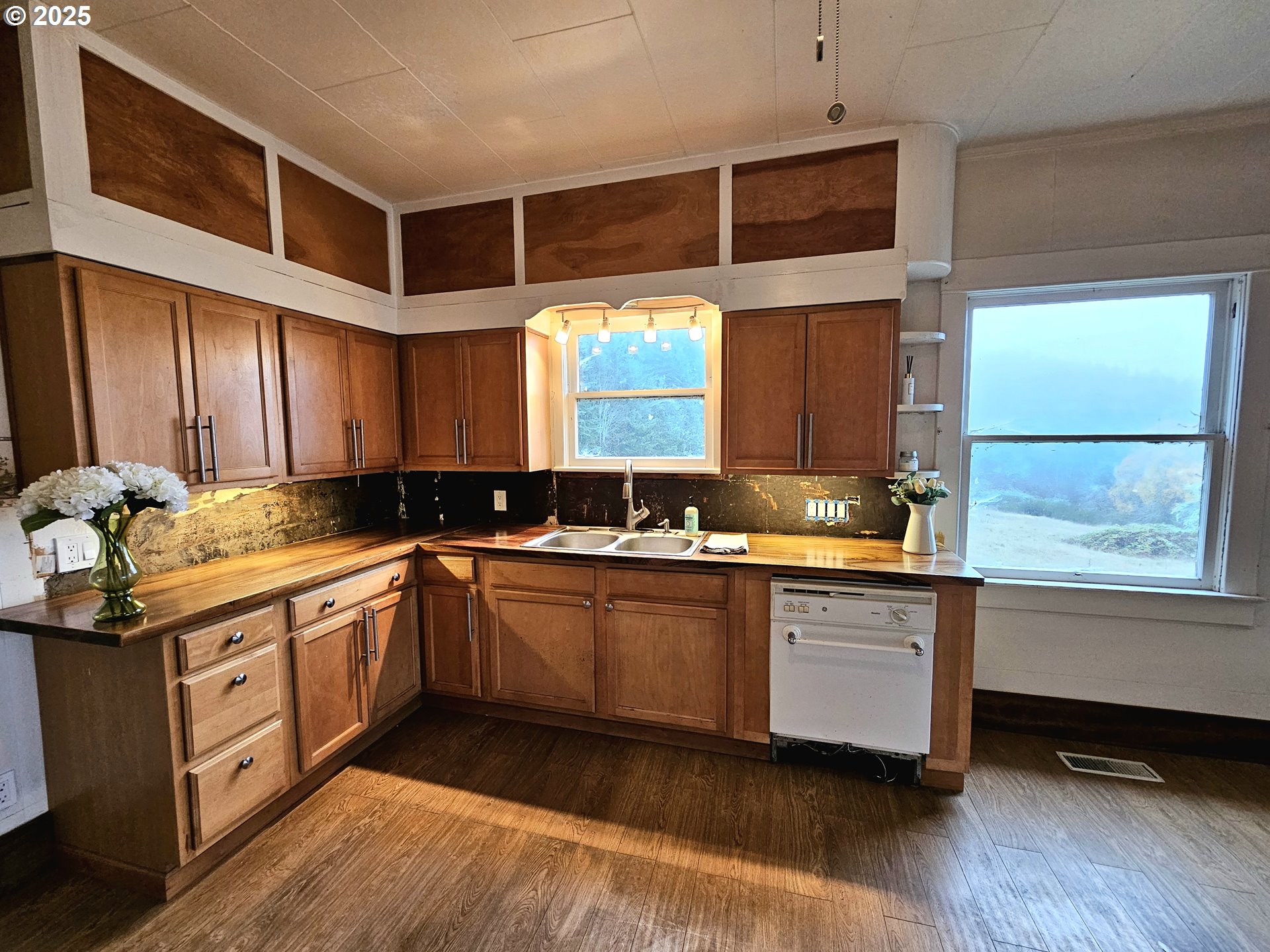 32373 Southwest JP W Road Scappoose, OR 97056 - Photo 13 of 44 a kitchen with stainless steel appliances granite countertop a stove and a sink