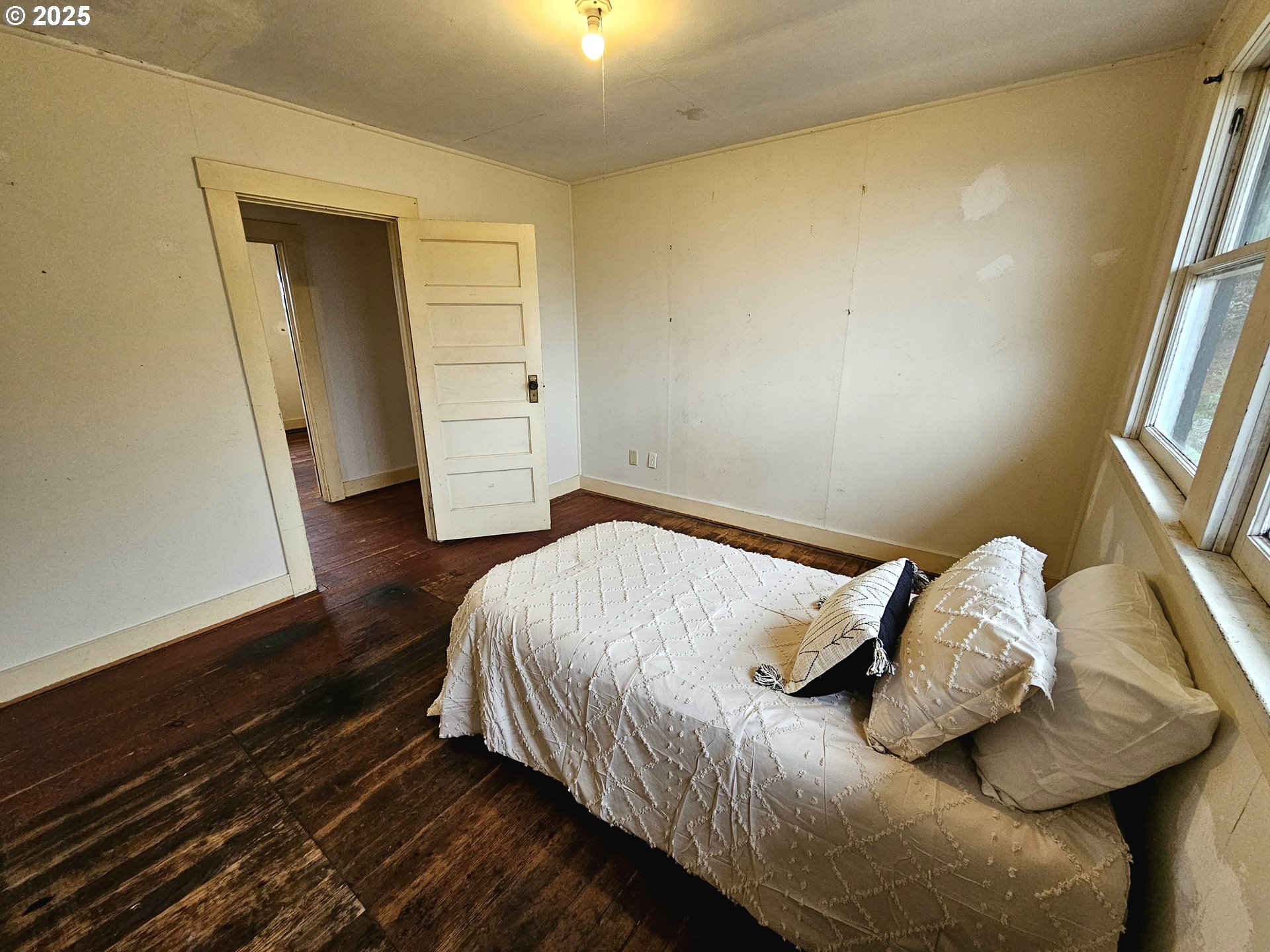 32373 Southwest JP W Road Scappoose, OR 97056 - Photo 26 of 44 a bedroom with a bed and a window