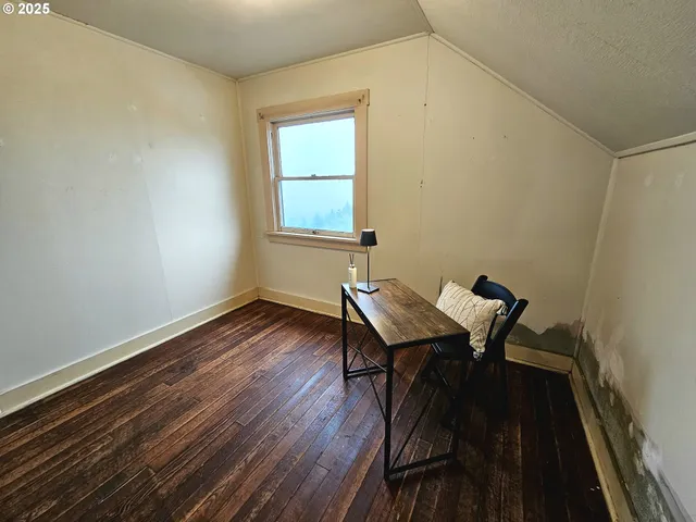 a workspace with furniture and wooden floor