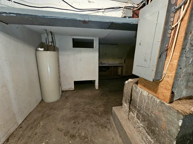 a view of a livingroom with furniture and a window