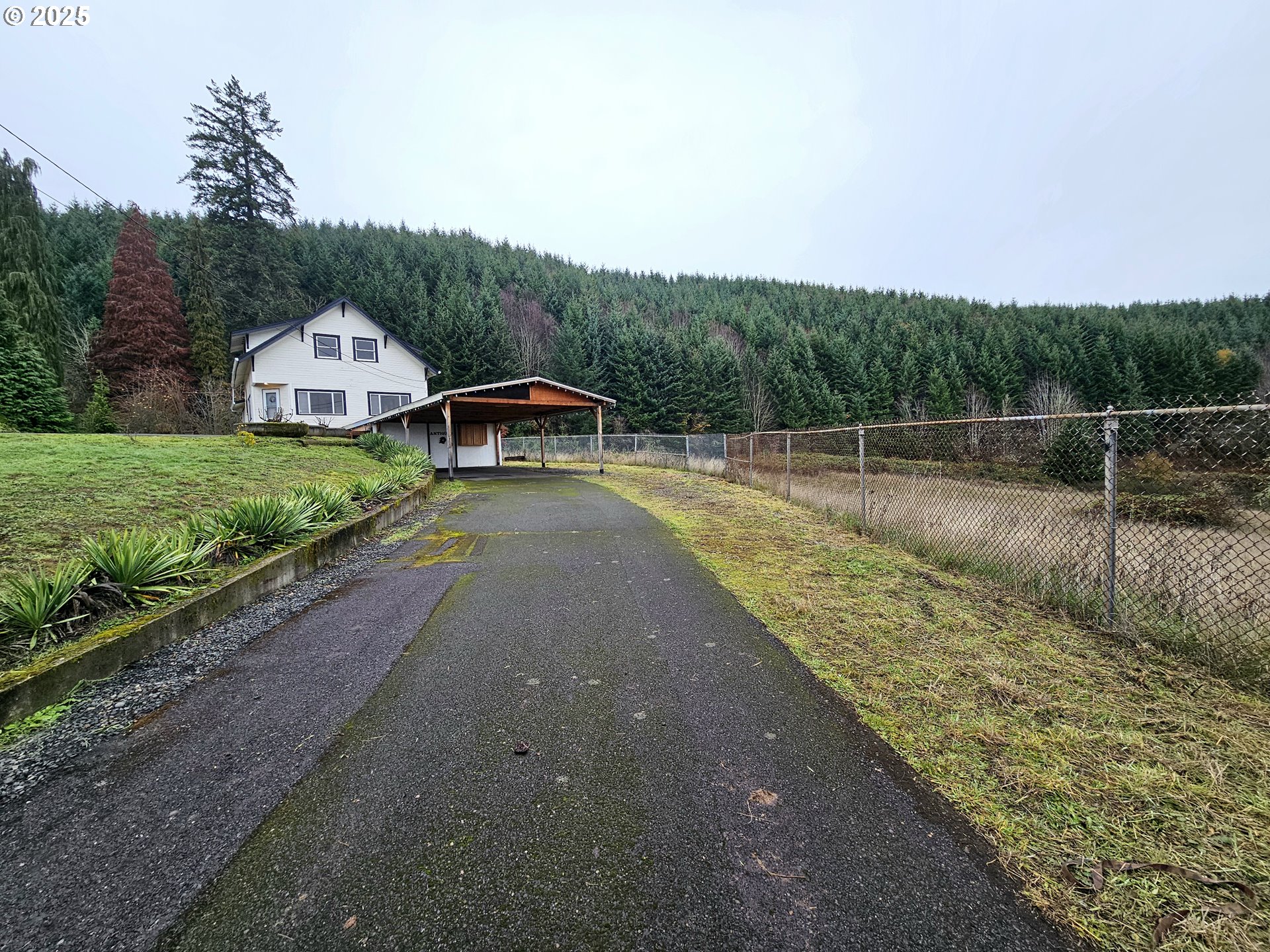 32373 Southwest JP W Road Scappoose, OR 97056 - Photo 40 of 44 a view of a house with a yard